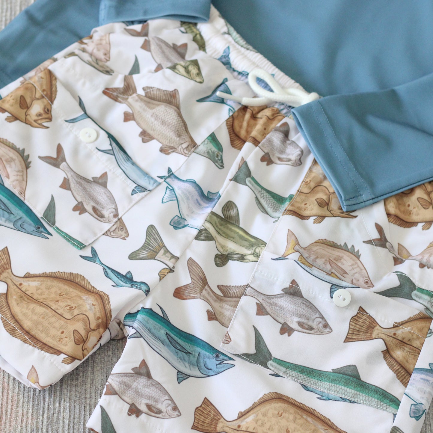 TEAL FISH RASH GUARD & TRUNKS