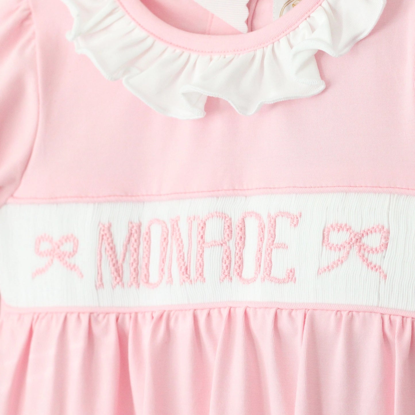 PINK KNIT BOW NAME SMOCK FOOTIE