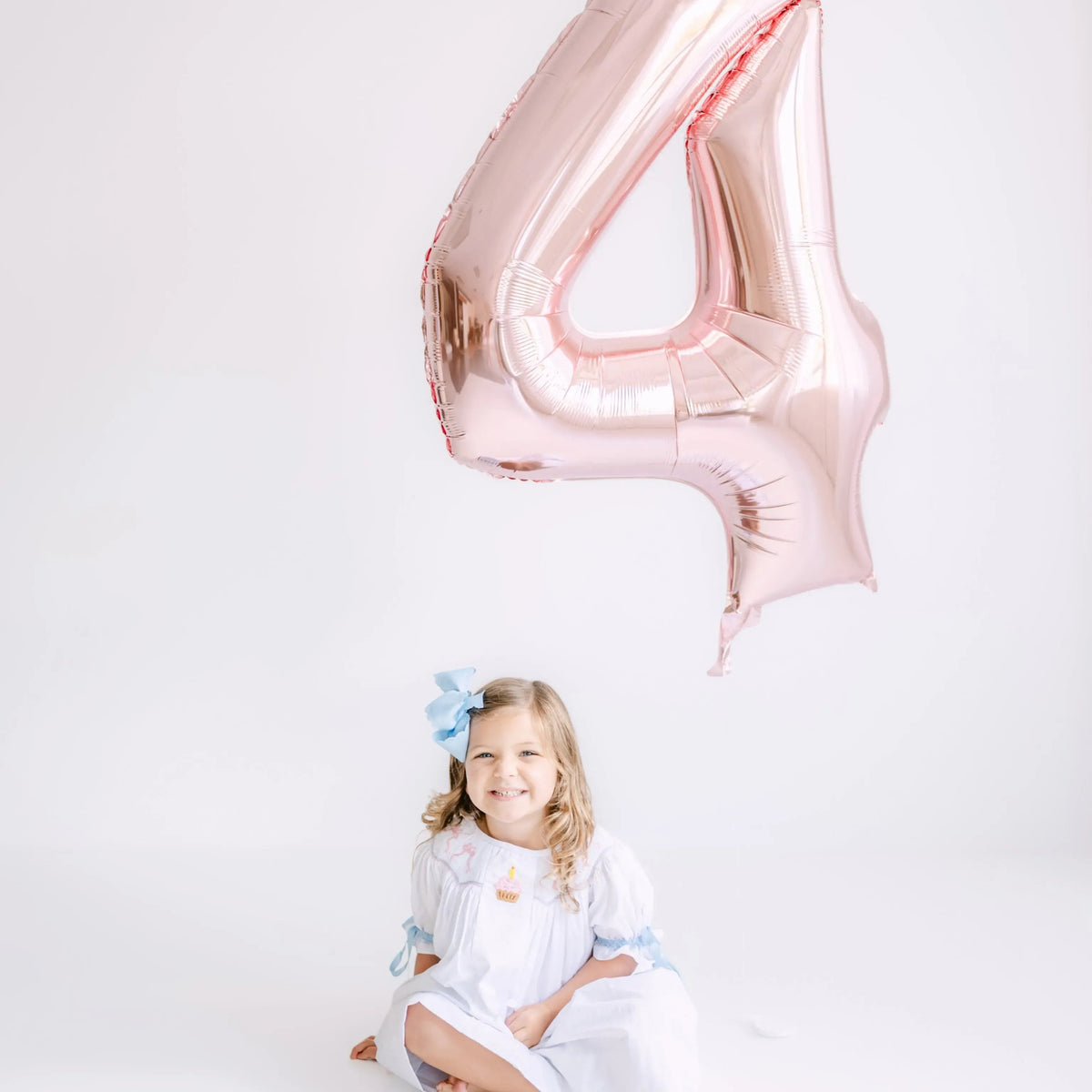 Birthday Bows Smocked Dress